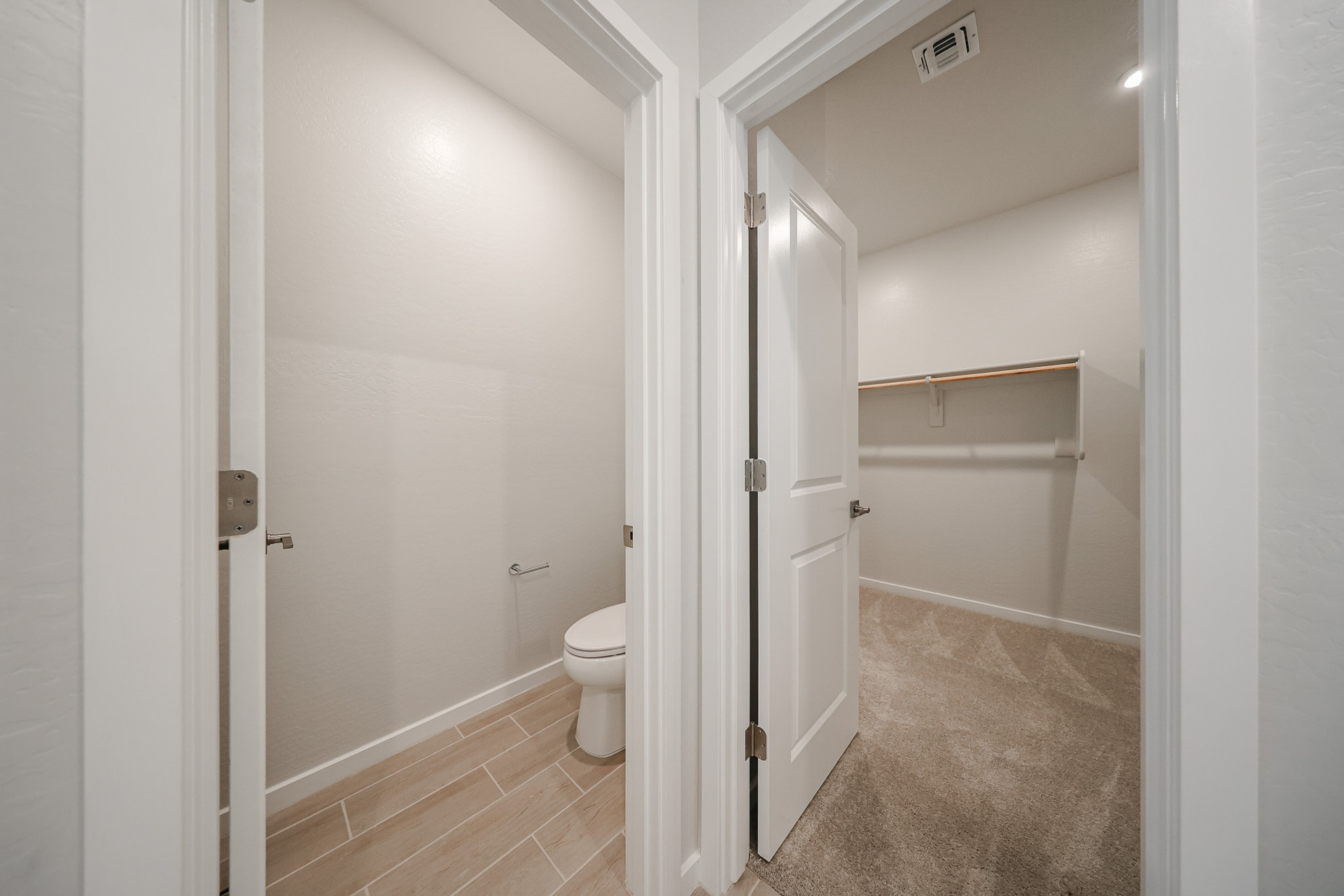 A bathroom with a toilet and shower.