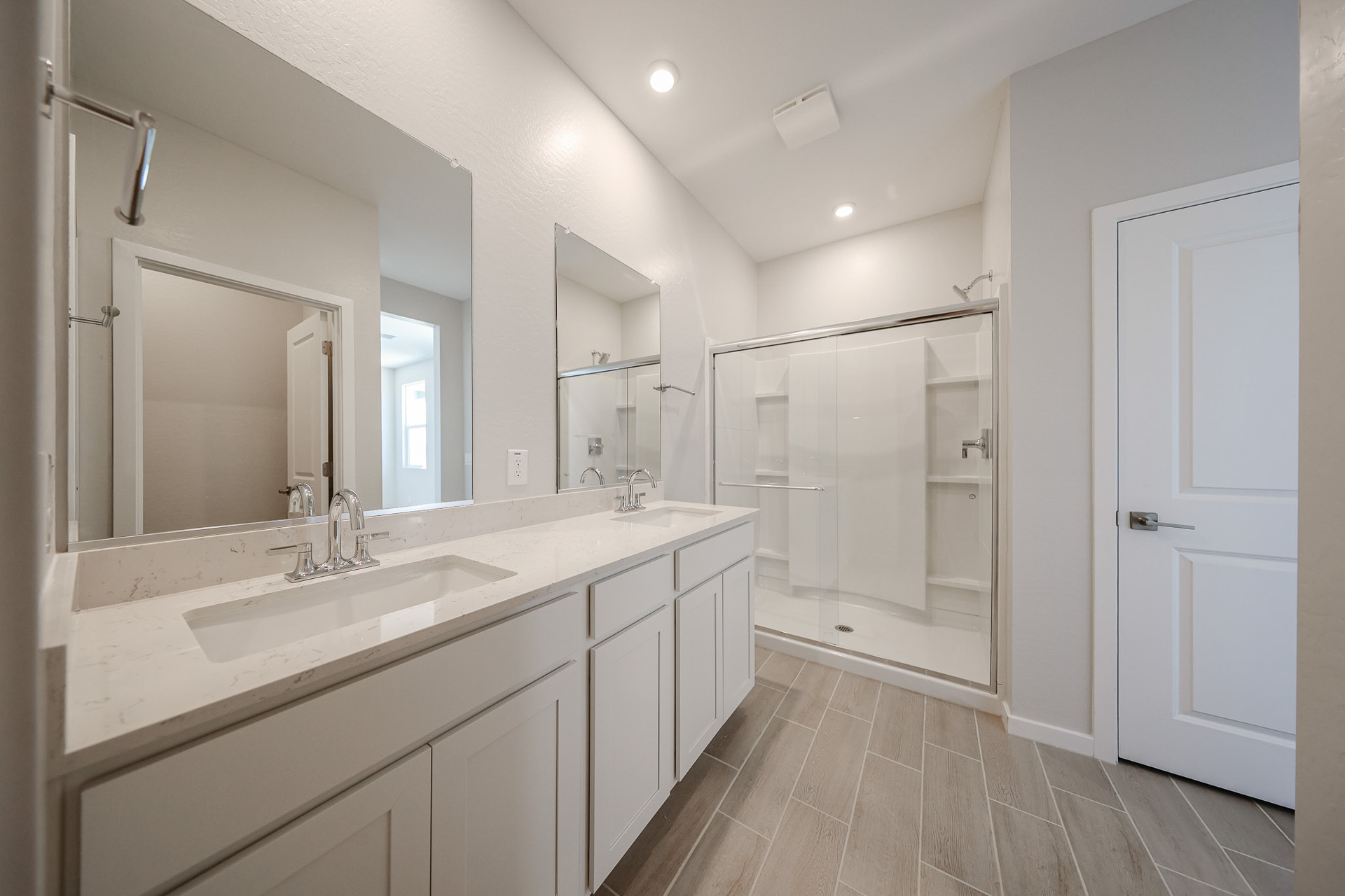 A bathroom with a glass shower.
