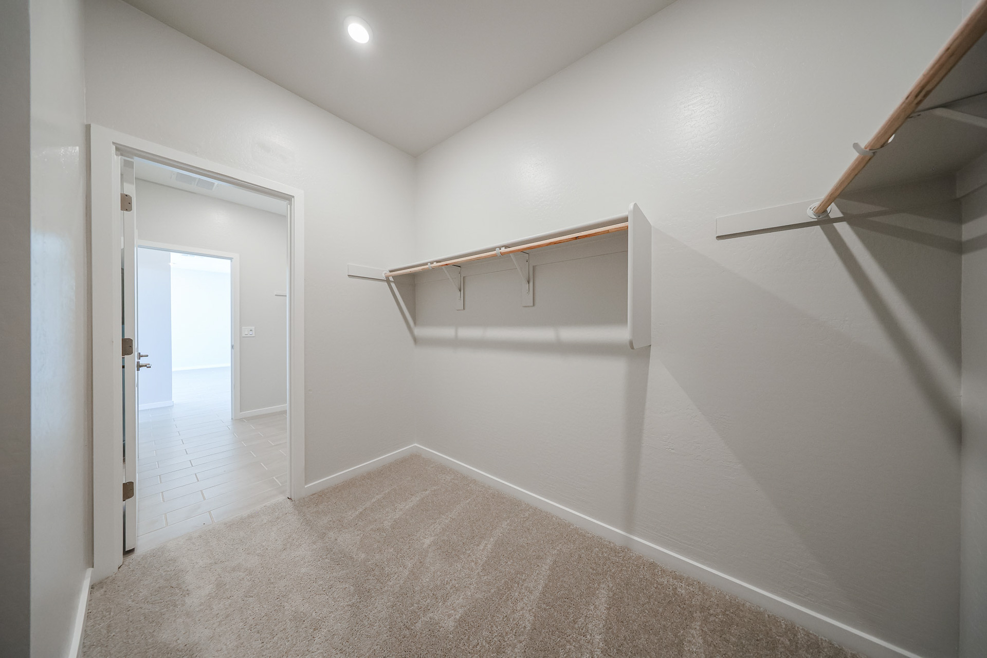 A hallway with white walls.