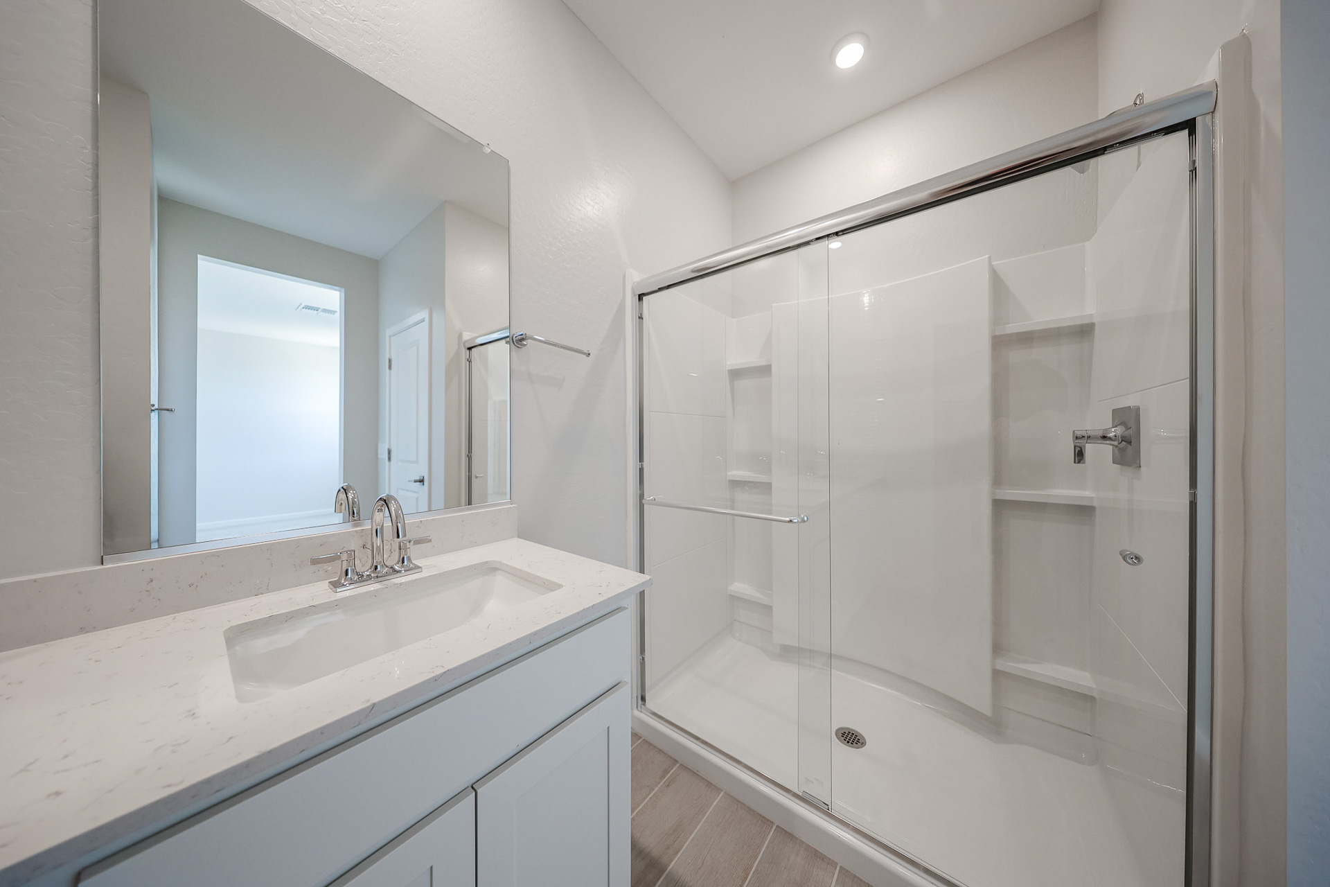 A bathroom with a glass shower.