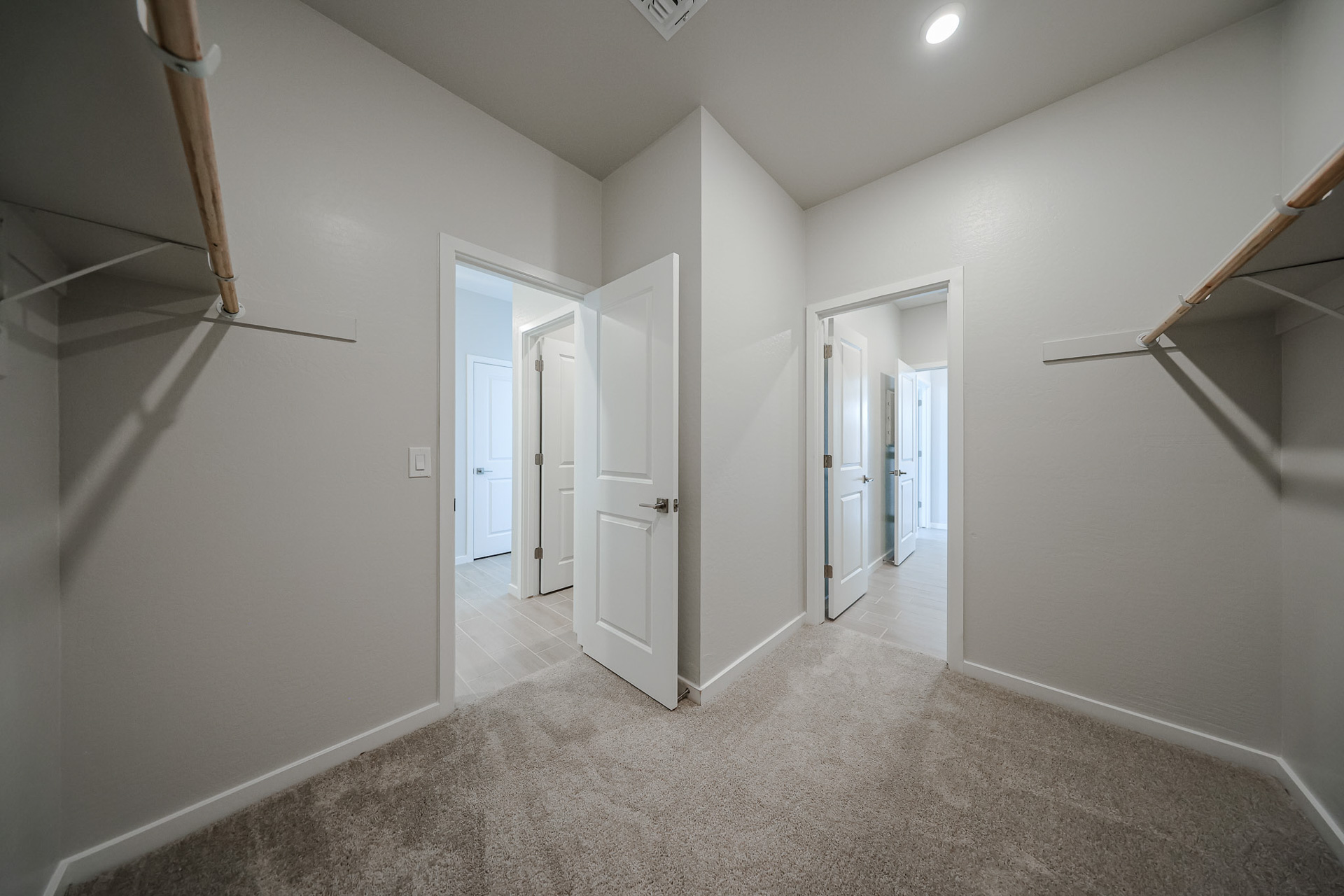 A hallway with white walls.