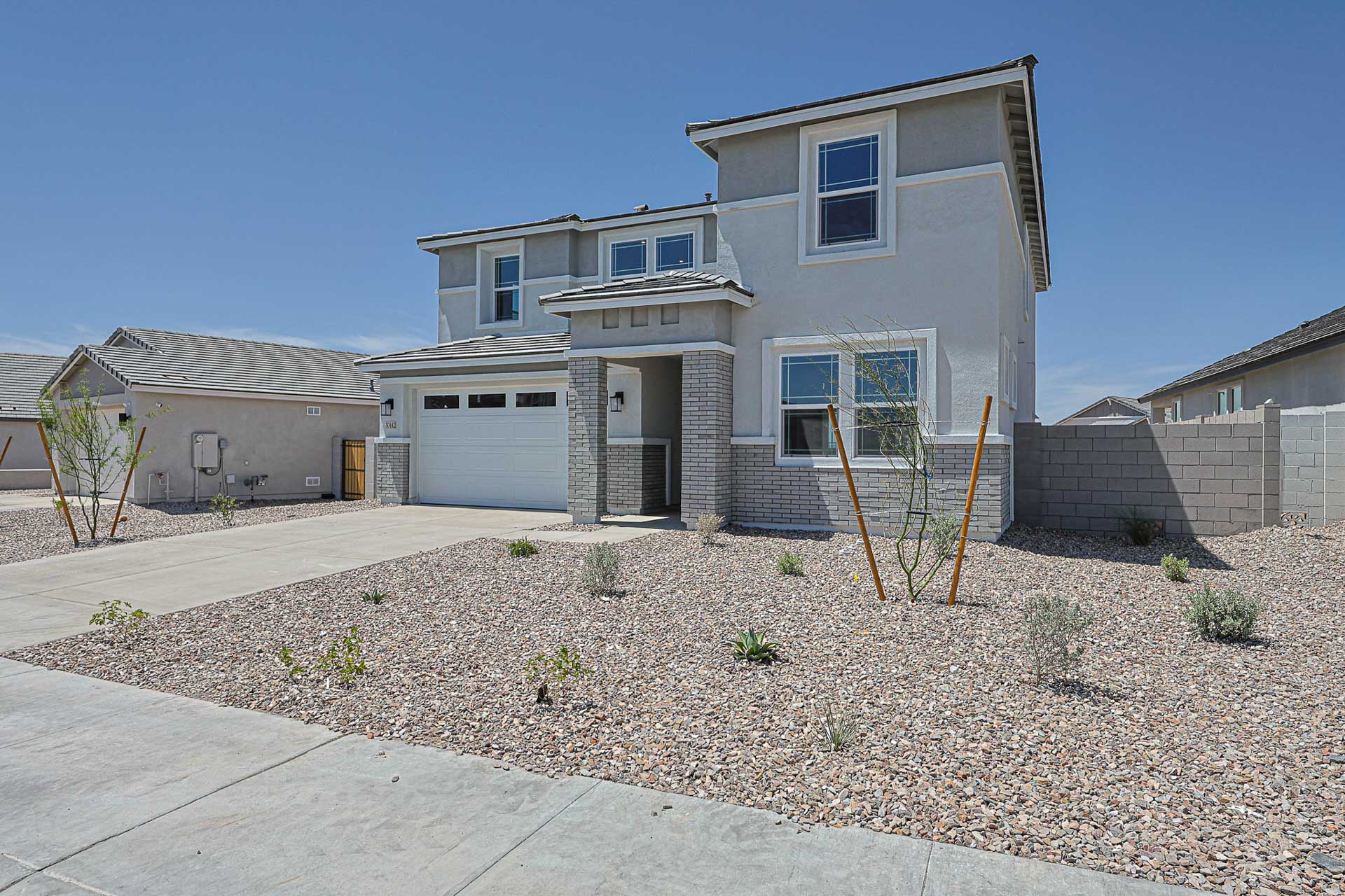 A house with a gravel yard.