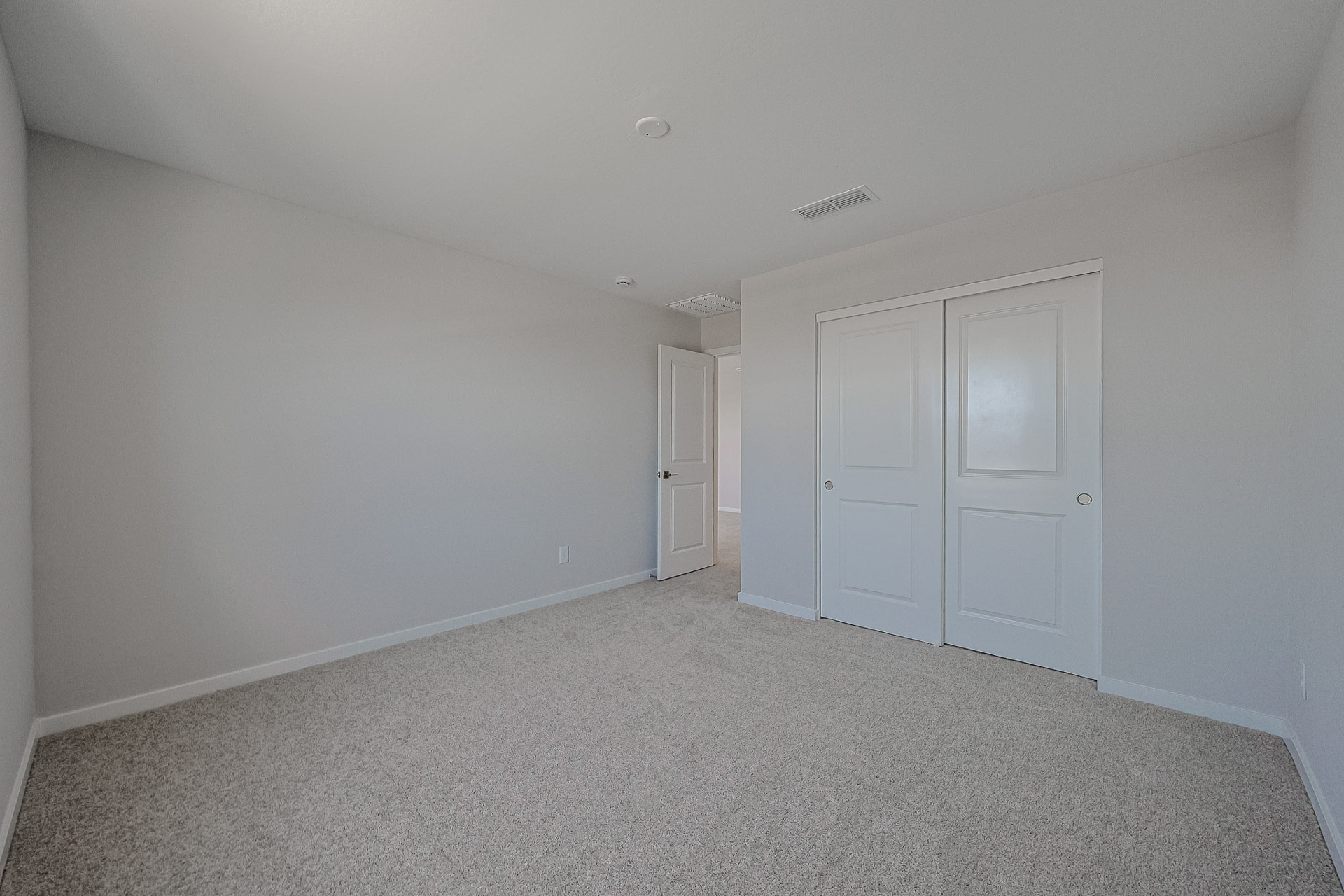 A room with white doors.