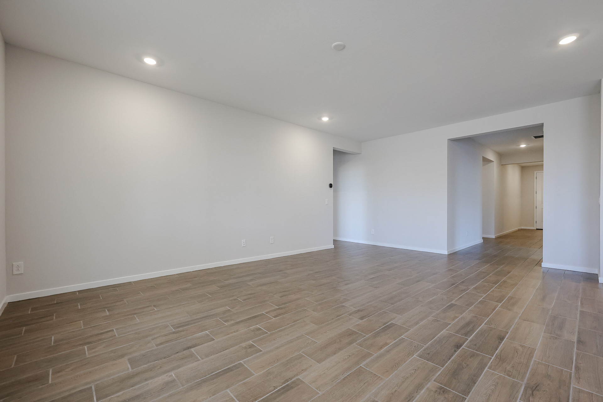 A room with a wood floor.
