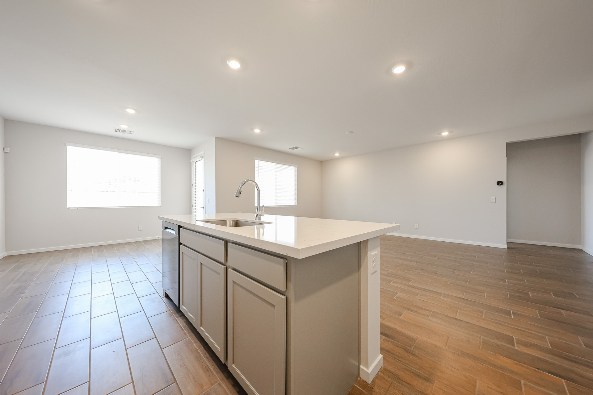 A kitchen with wooden floors.
