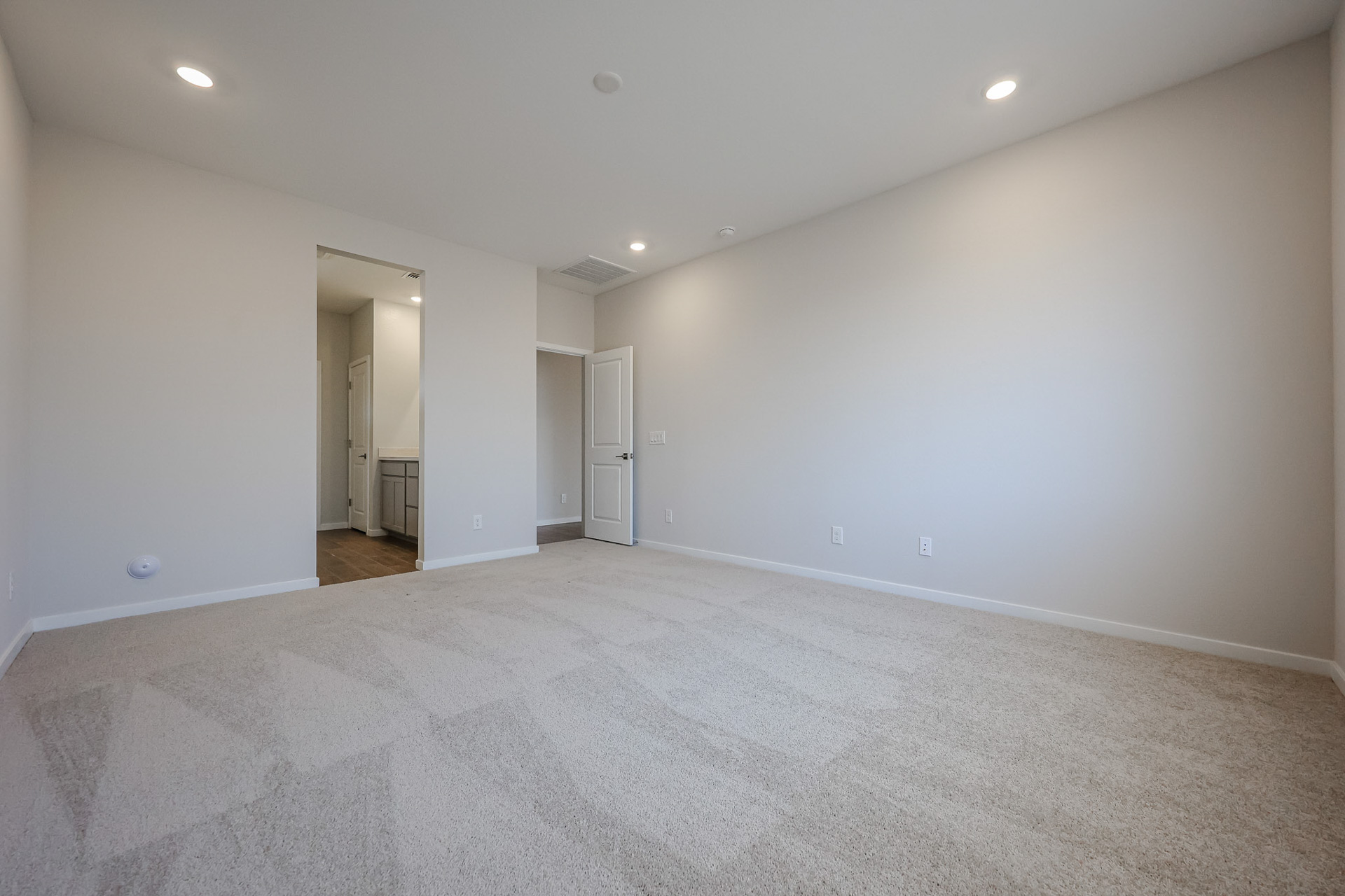 A long hallway with white walls.