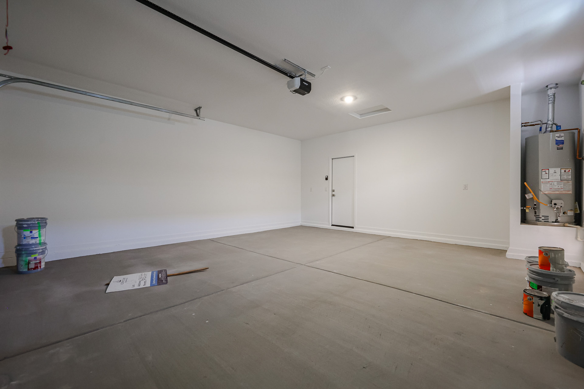 A room with a white wall and a white door.