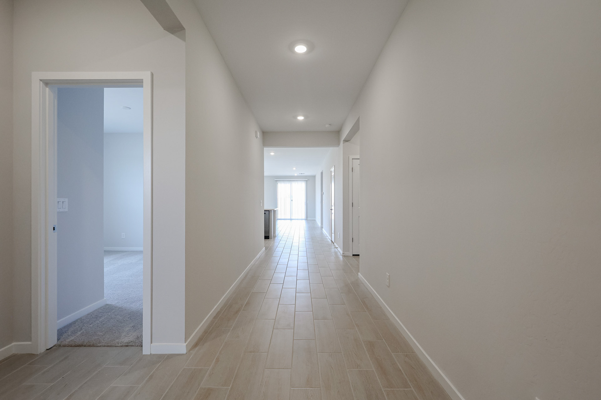 A long hallway with white walls.