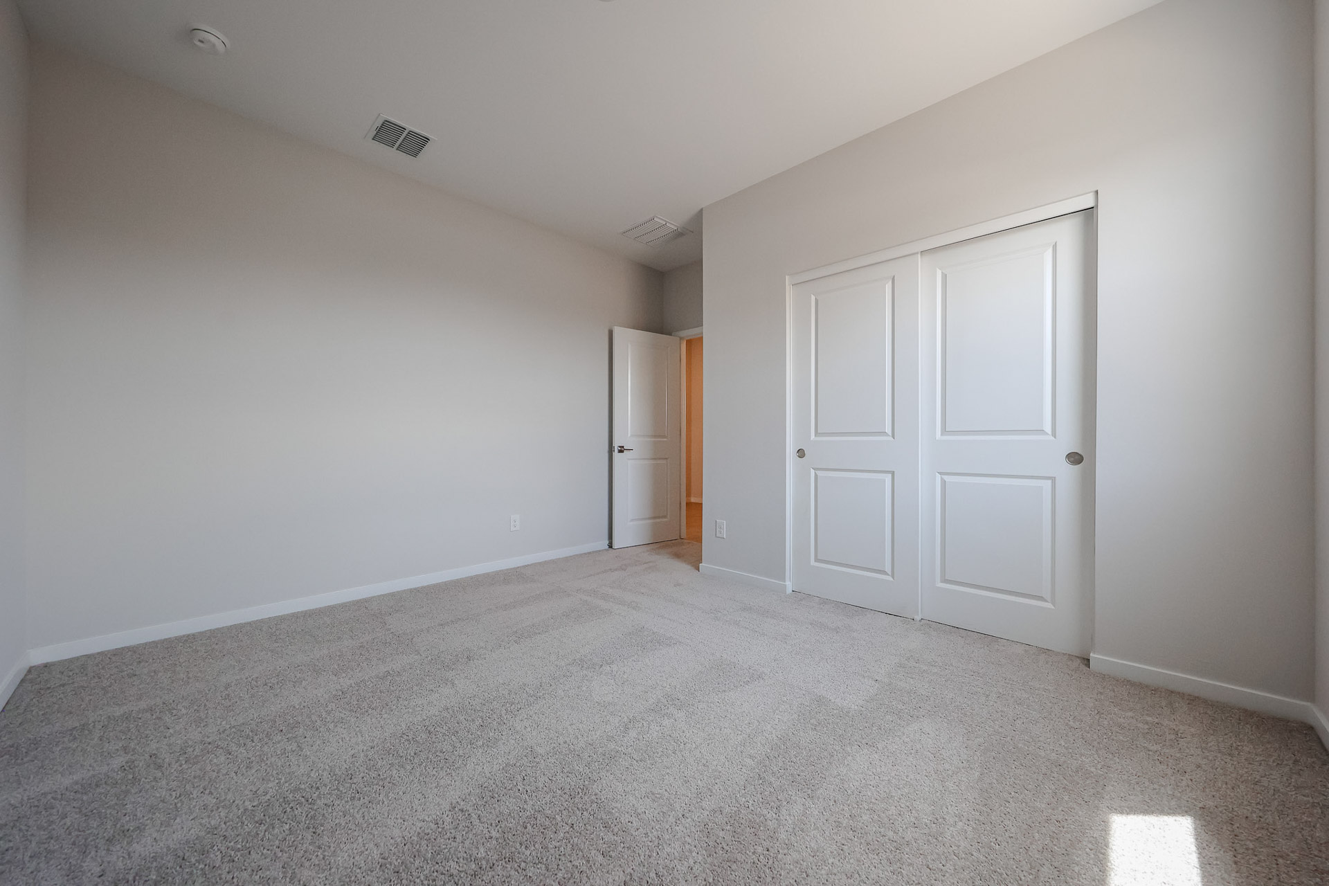 A room with white doors.