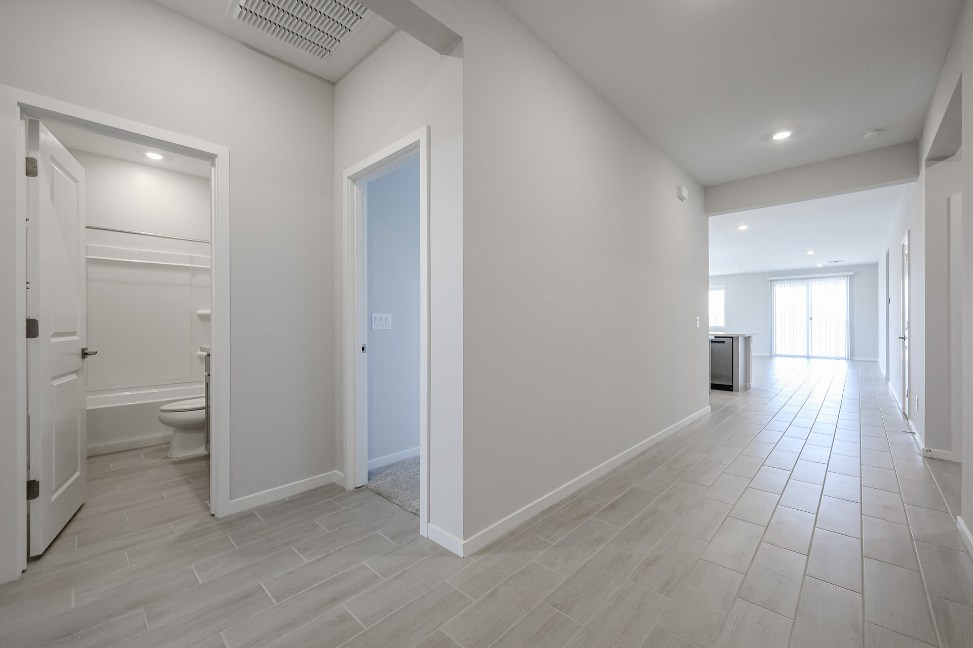 A bathroom with white walls.