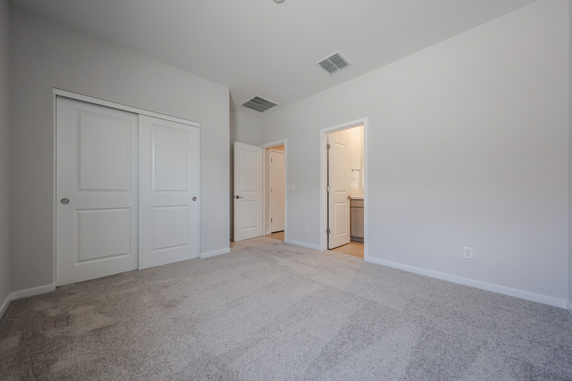 A room with white doors.