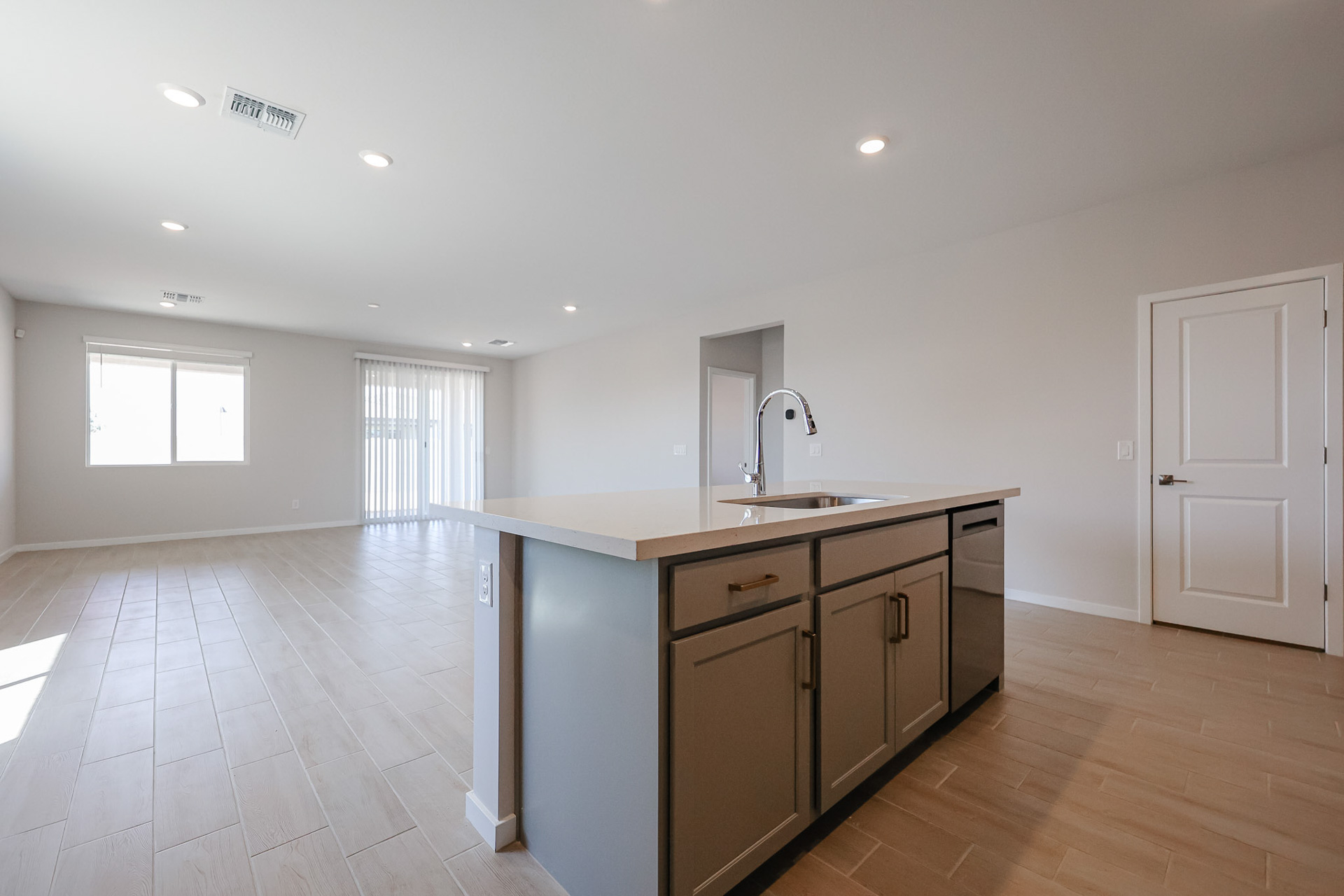 A kitchen with a sink and cabinets.