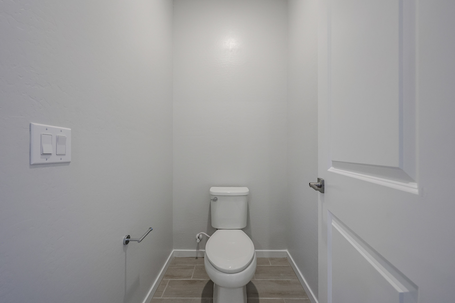 A toilet in a bathroom.