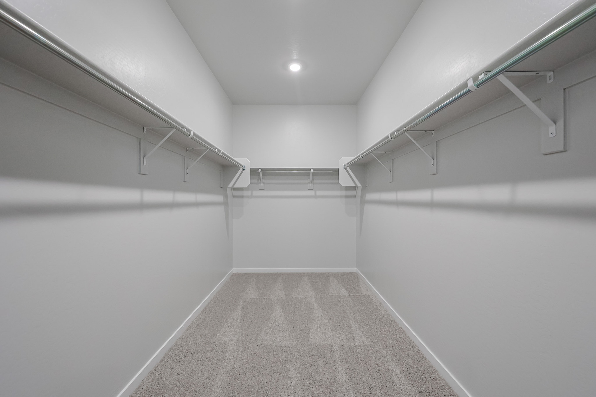 A hallway with white walls.