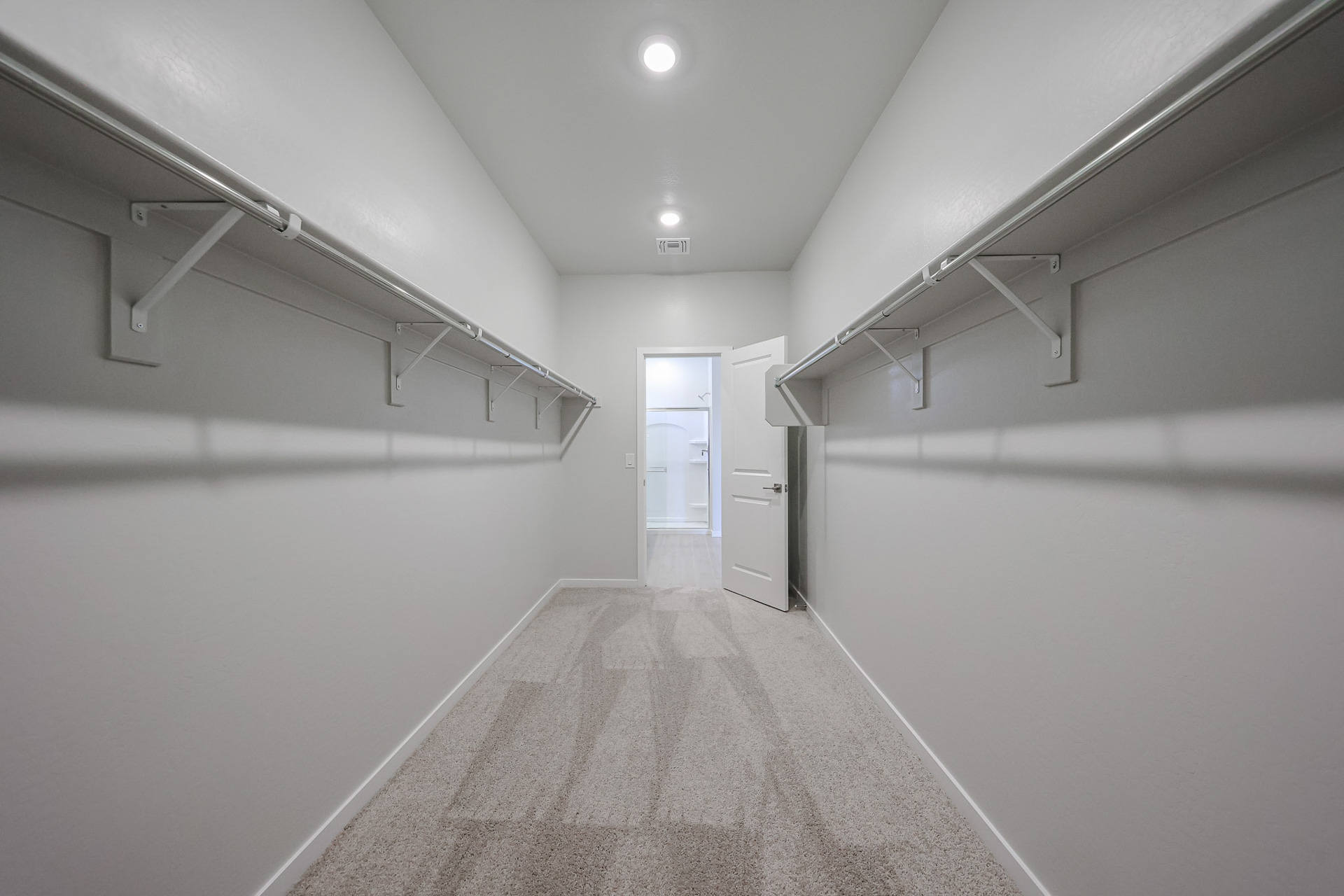 A long hallway with white walls.