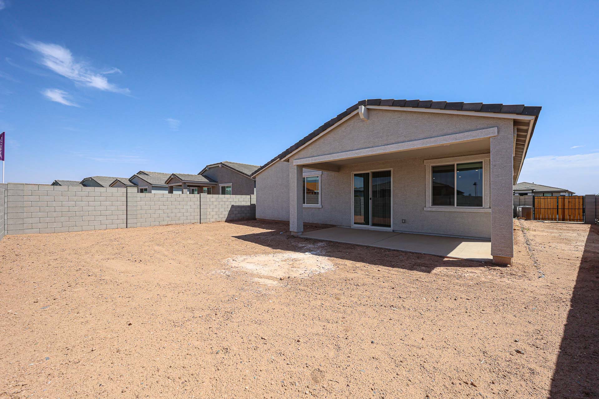 A house in a dirt field.