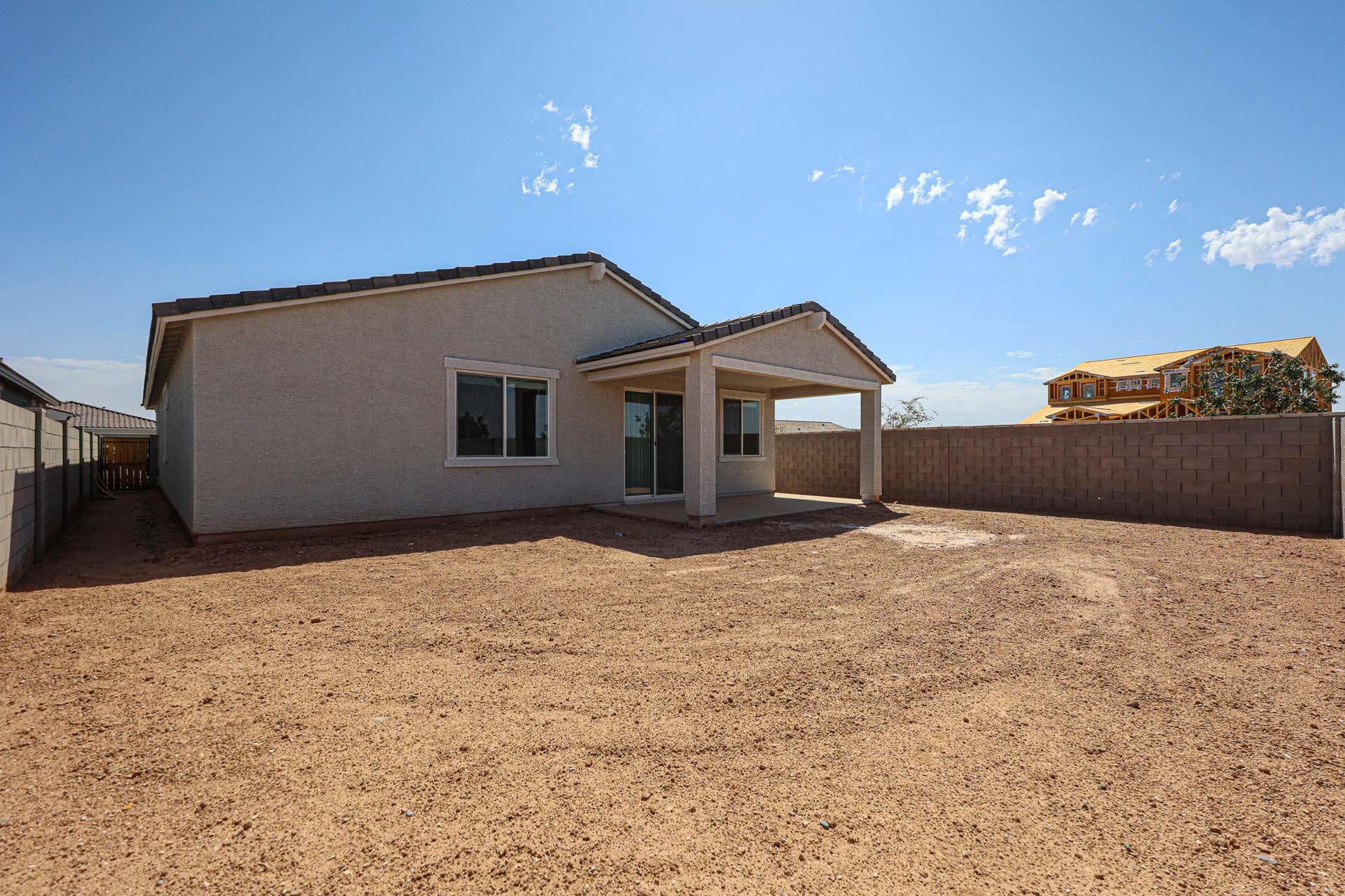 A house with a dirt yard.