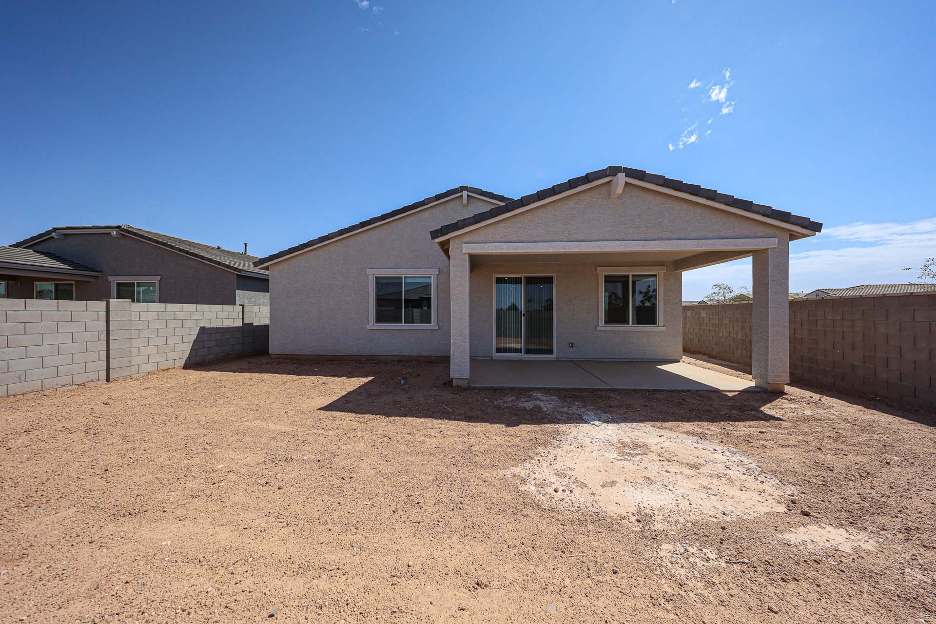 A house with a dirt yard.