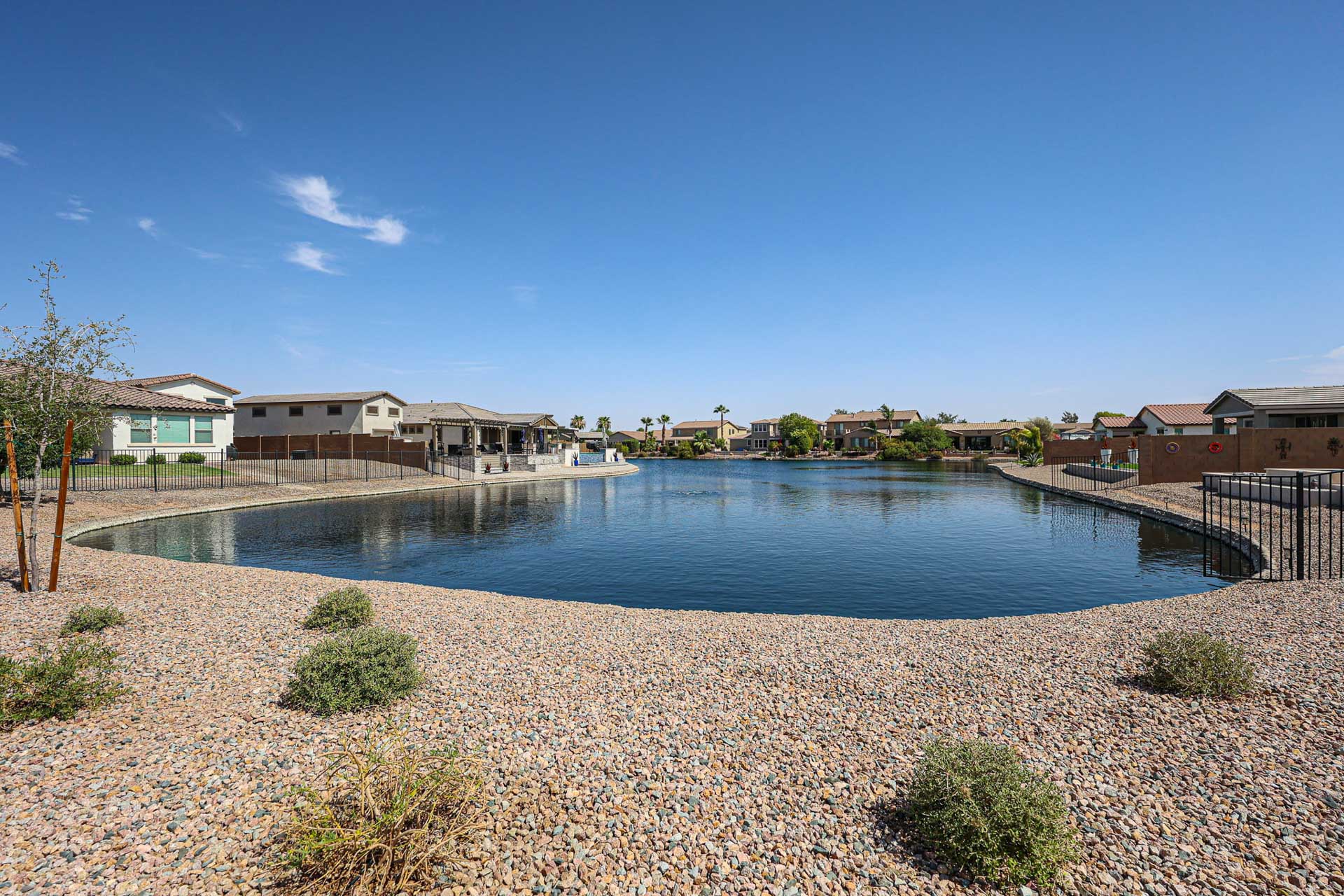 A body of water with houses along it.