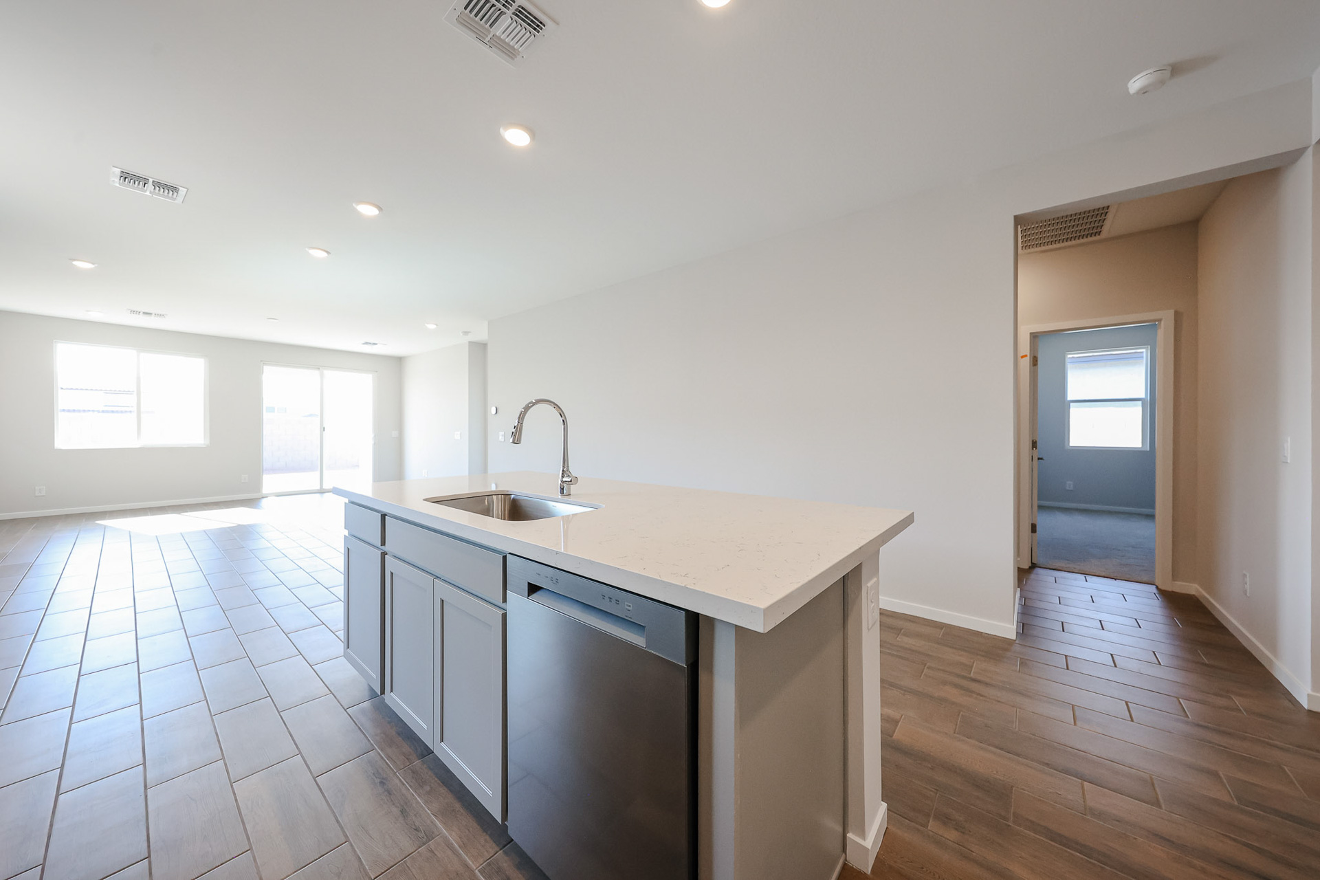 A kitchen with a sink and cabinets.