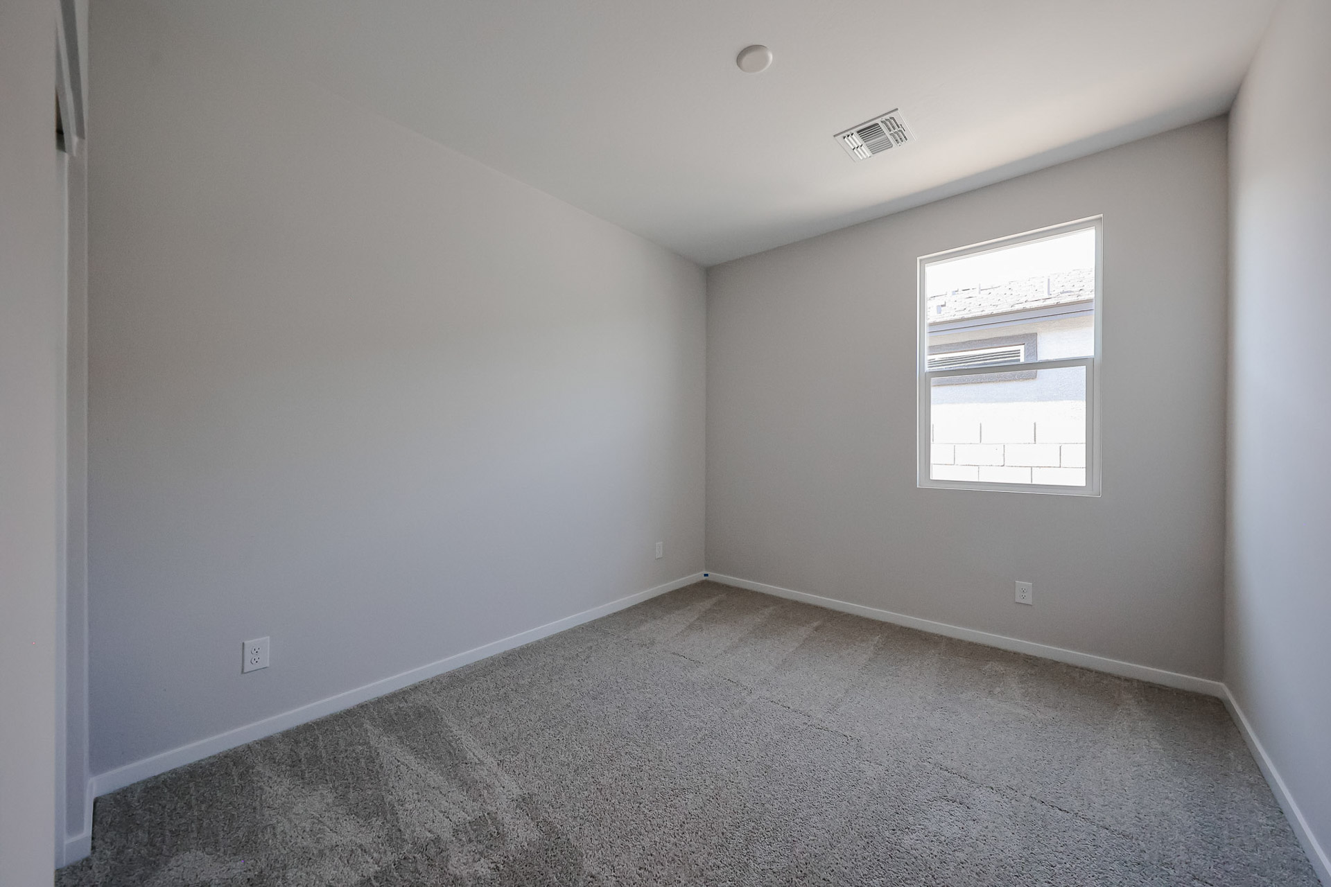 A hallway with a window.