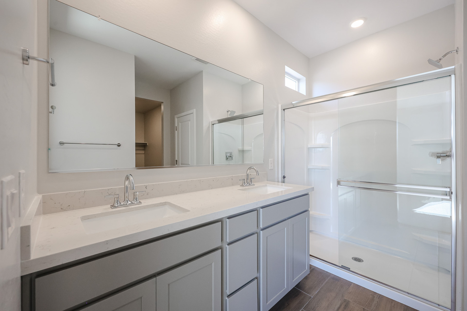 A bathroom with a glass shower.