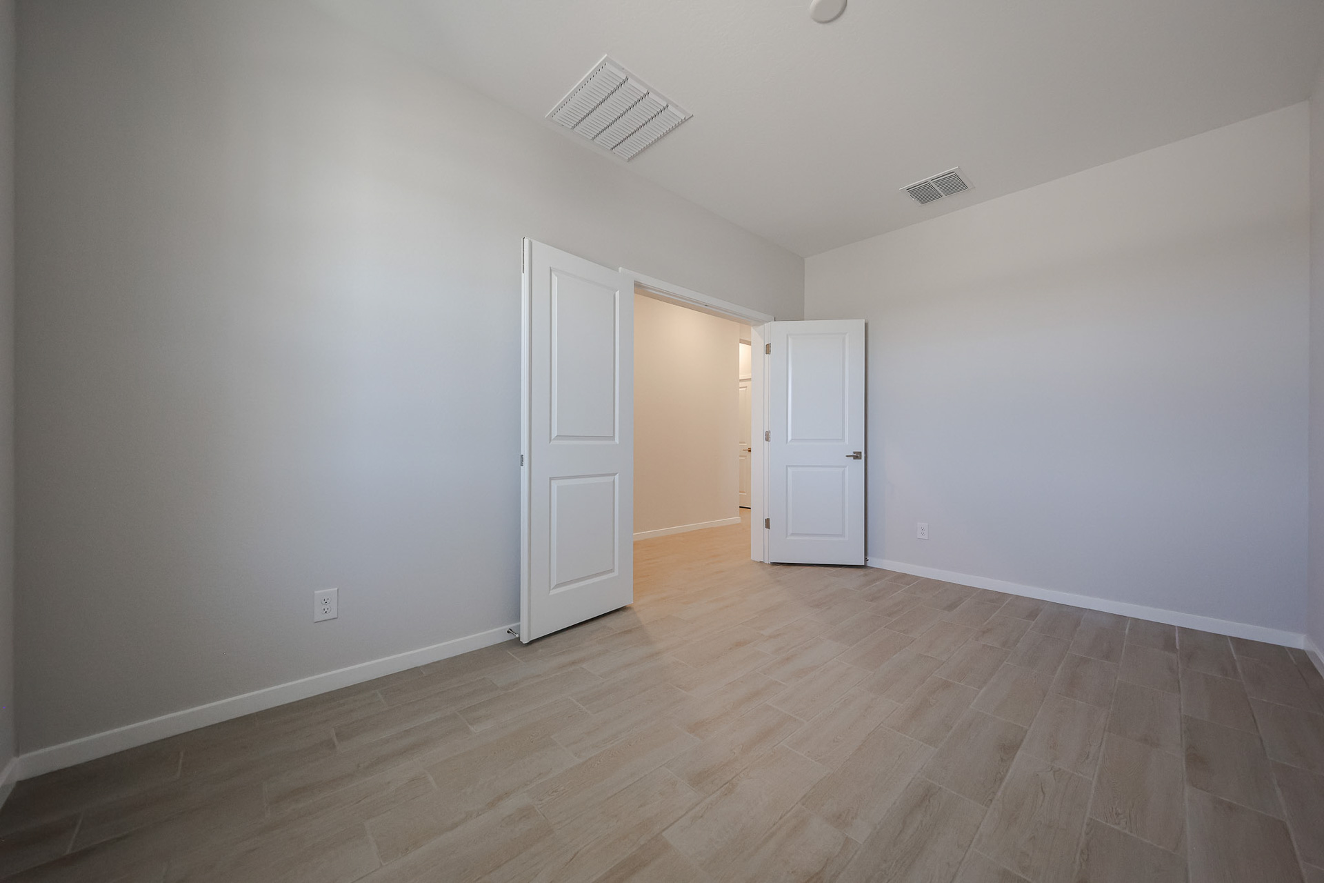 A room with white doors.