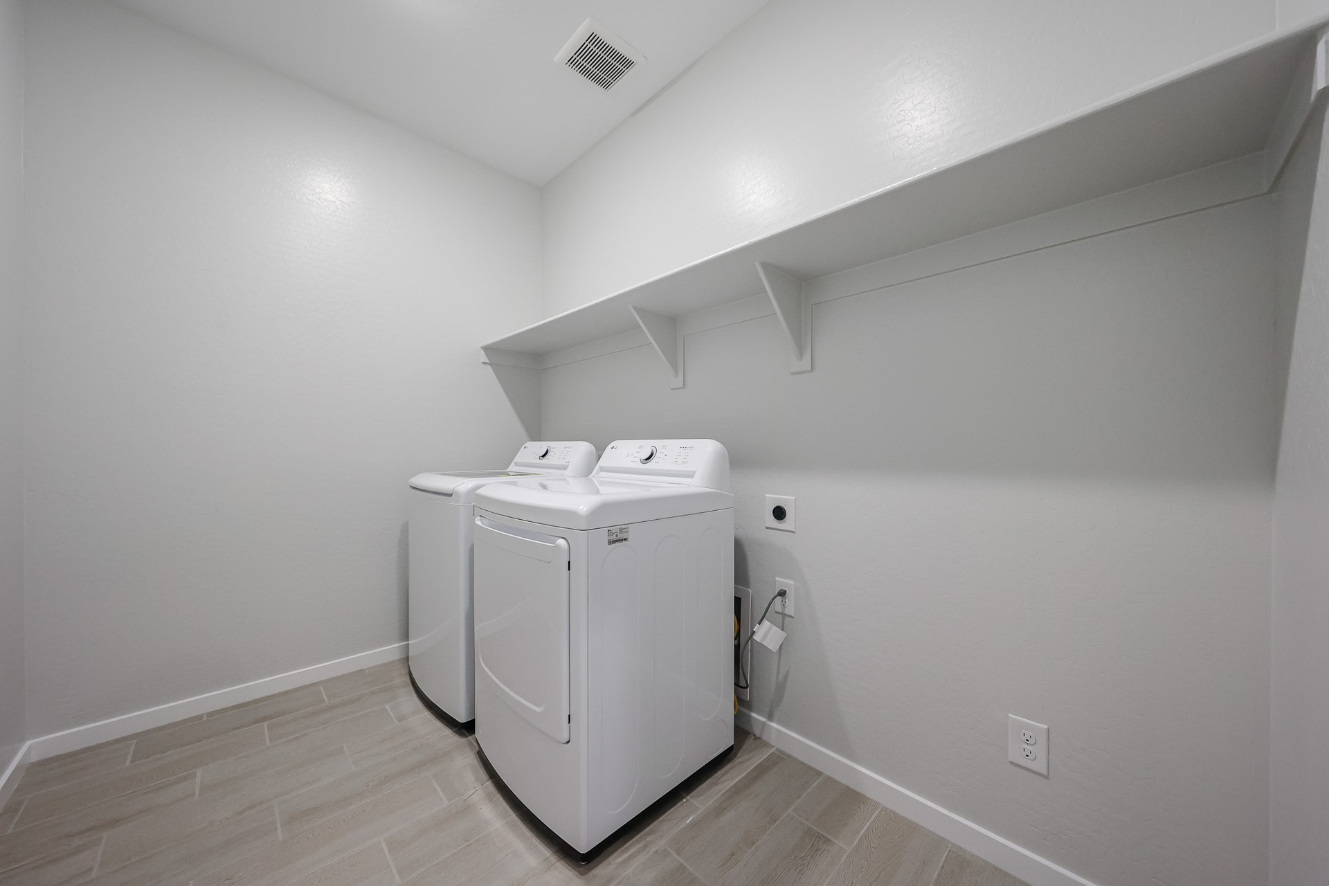 A white washing machine in a room.