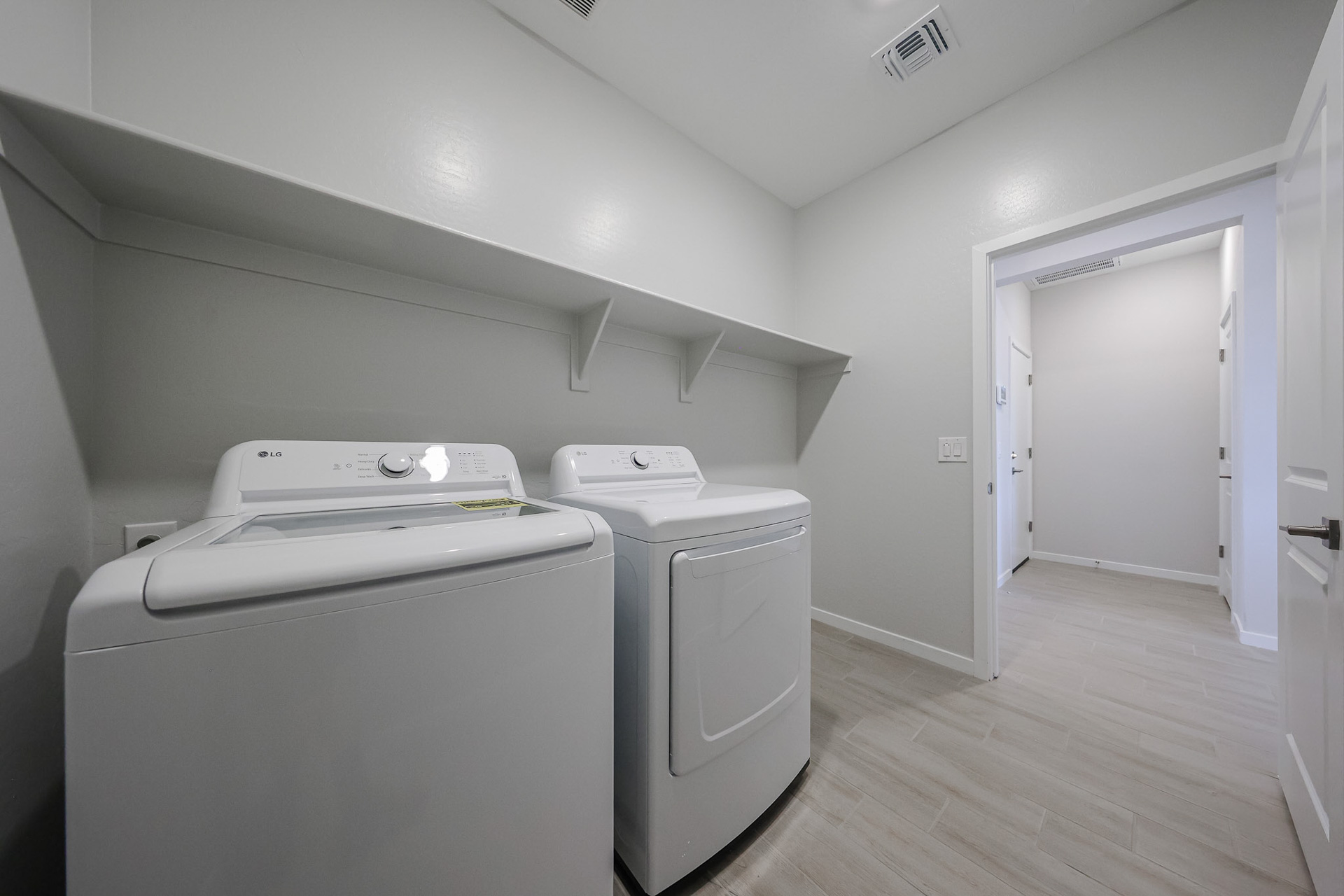 A laundry room with a washer and dryer.