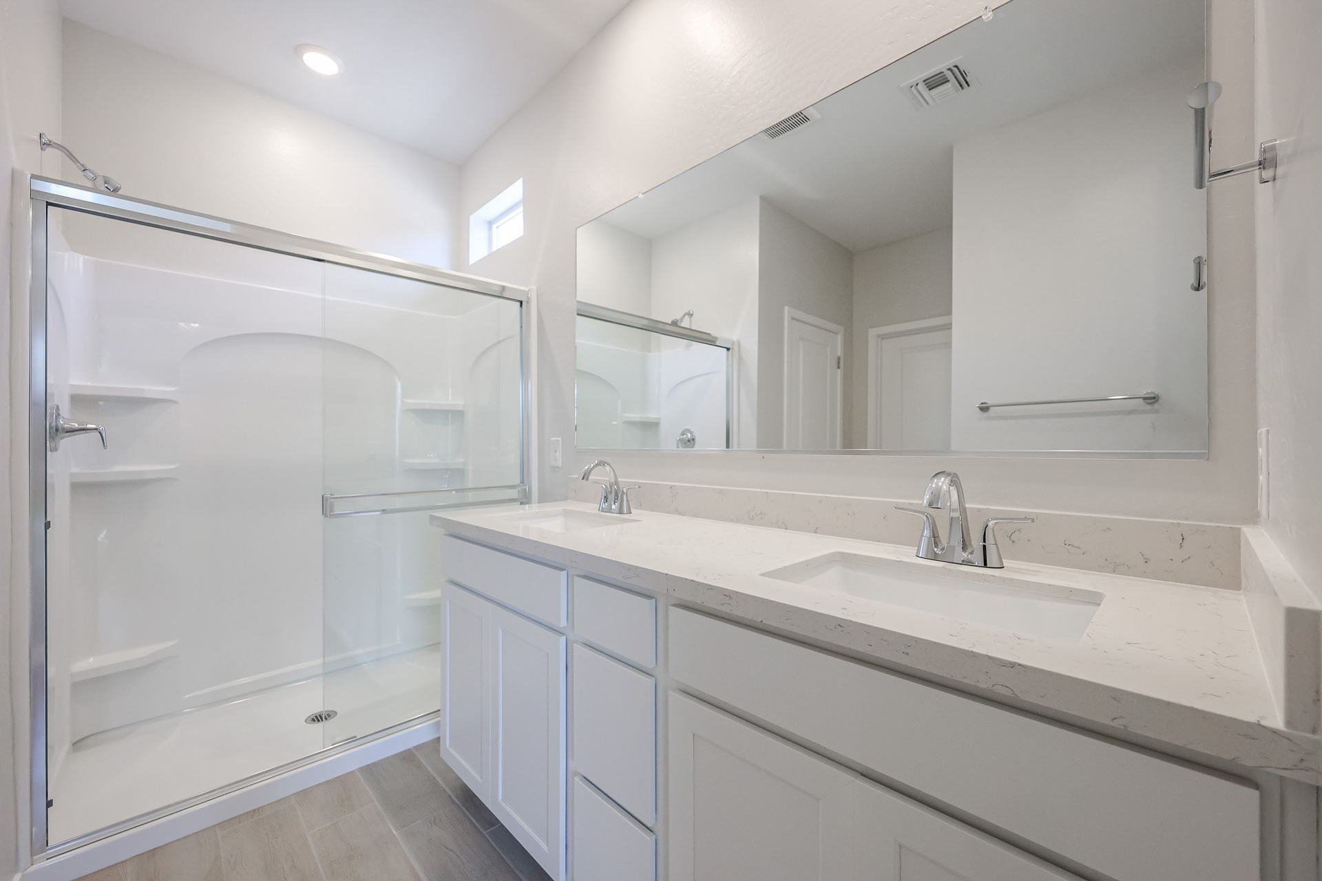 A bathroom with a glass shower.