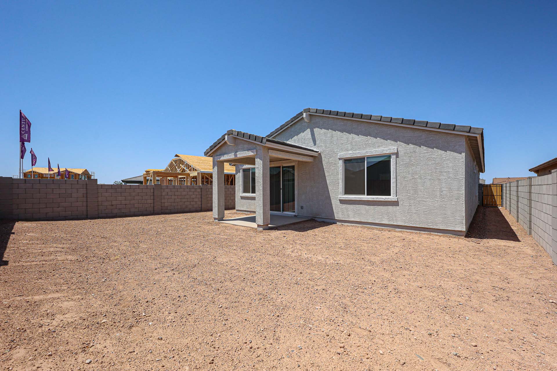 A house with a dirt yard.