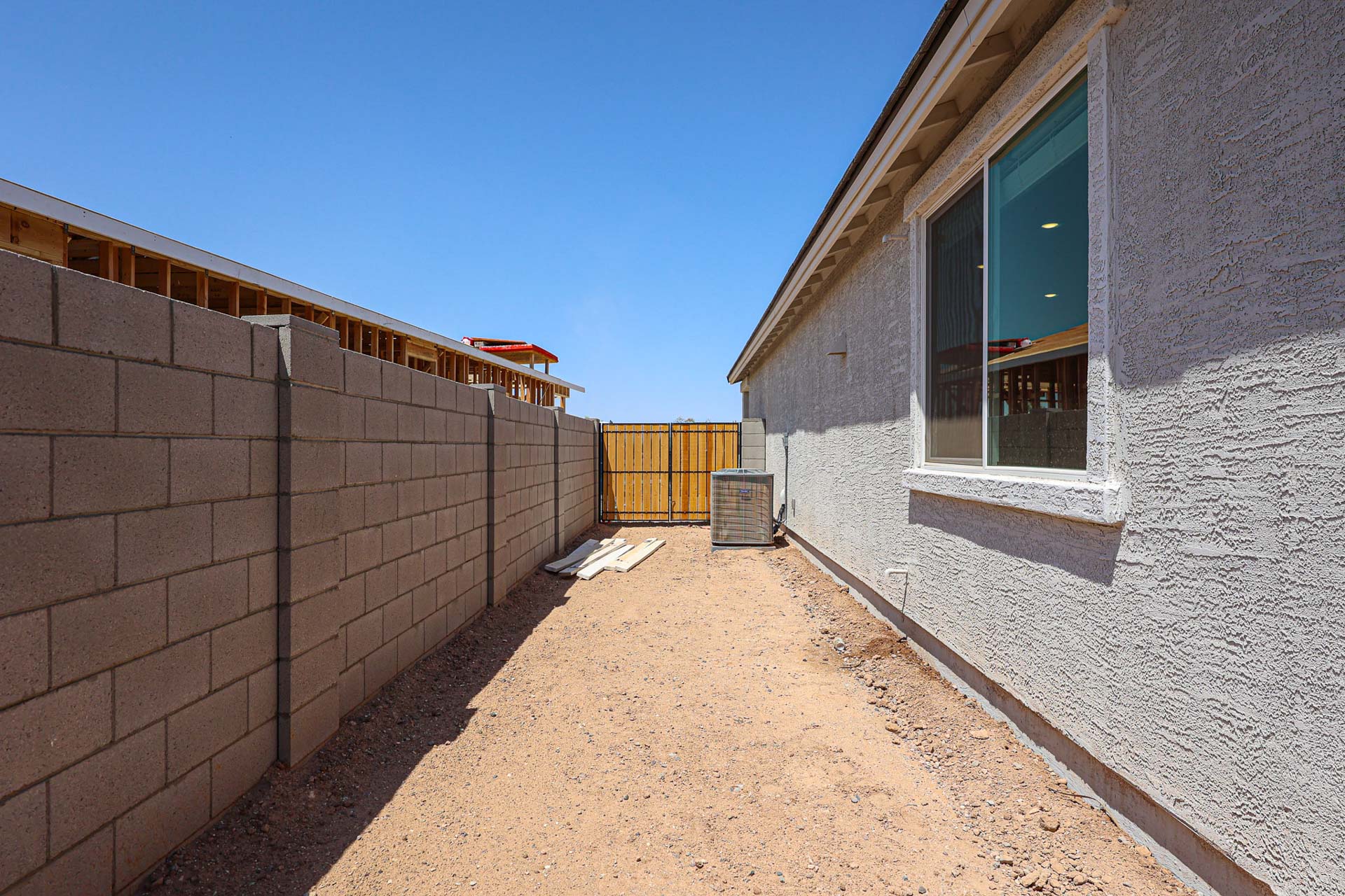 A brick building with a fence.