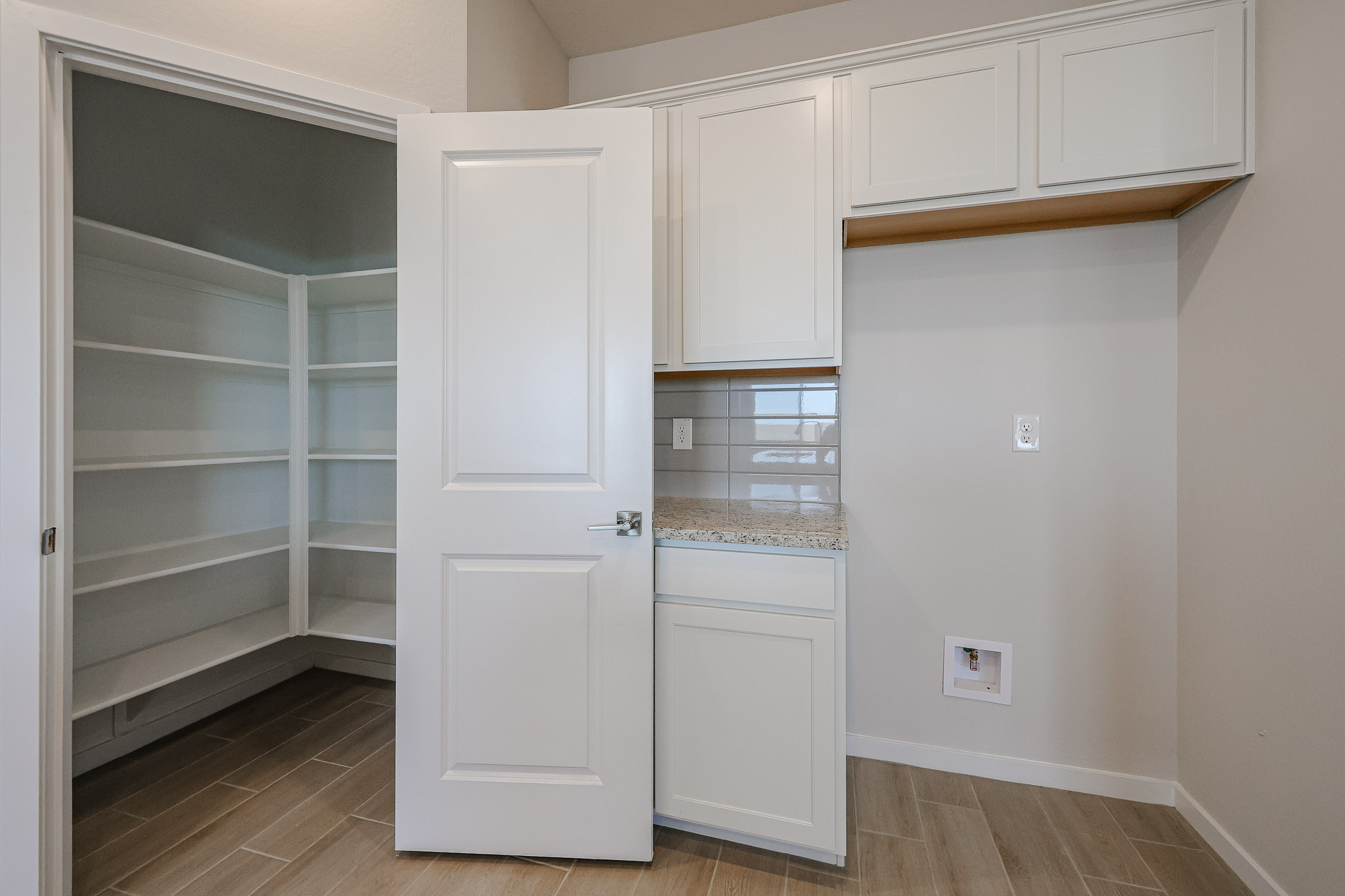 A white cabinet in a room.