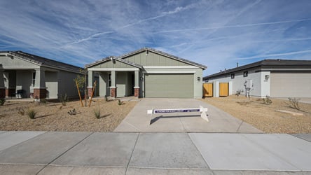 A group of buildings with a sign in front of them.