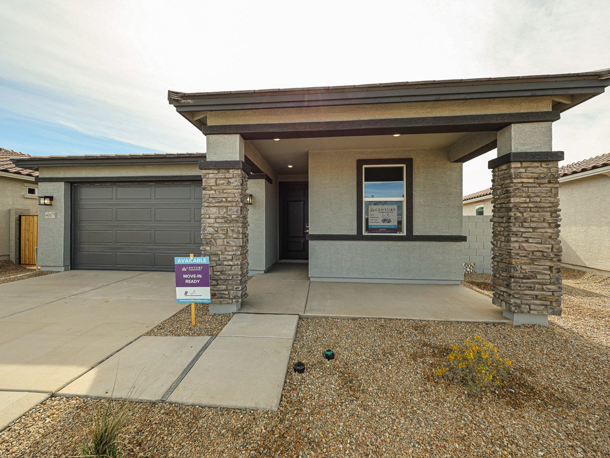 A building with a sign in front.