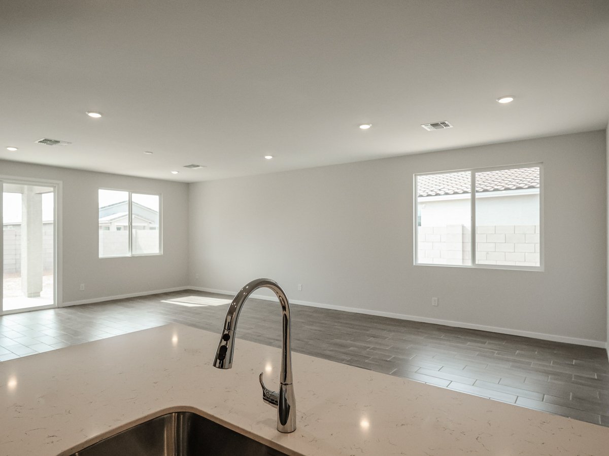 A kitchen with a sink and a faucet.