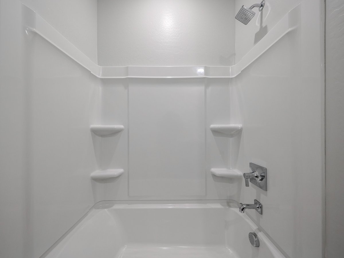 A bathroom with a toilet and sink.