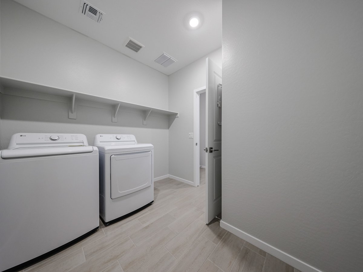 A room with white appliances.