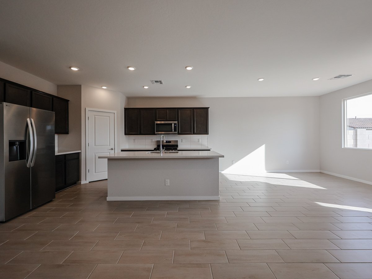 A kitchen with black appliances.