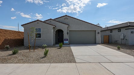 A building with garages and a sidewalk.
