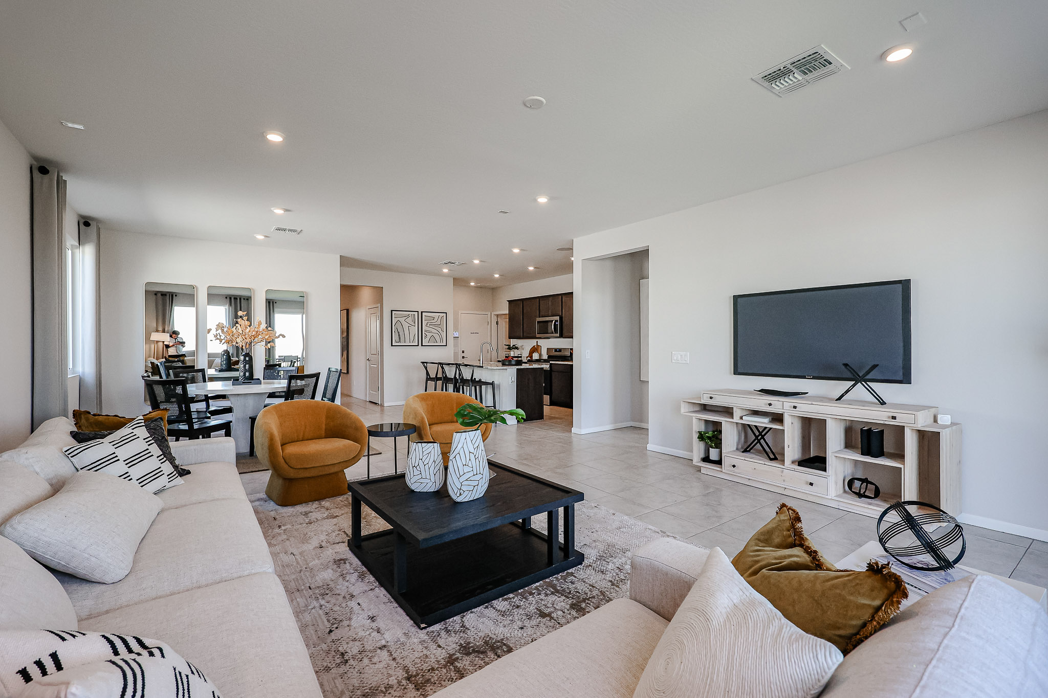 A living room with a tv and couches.