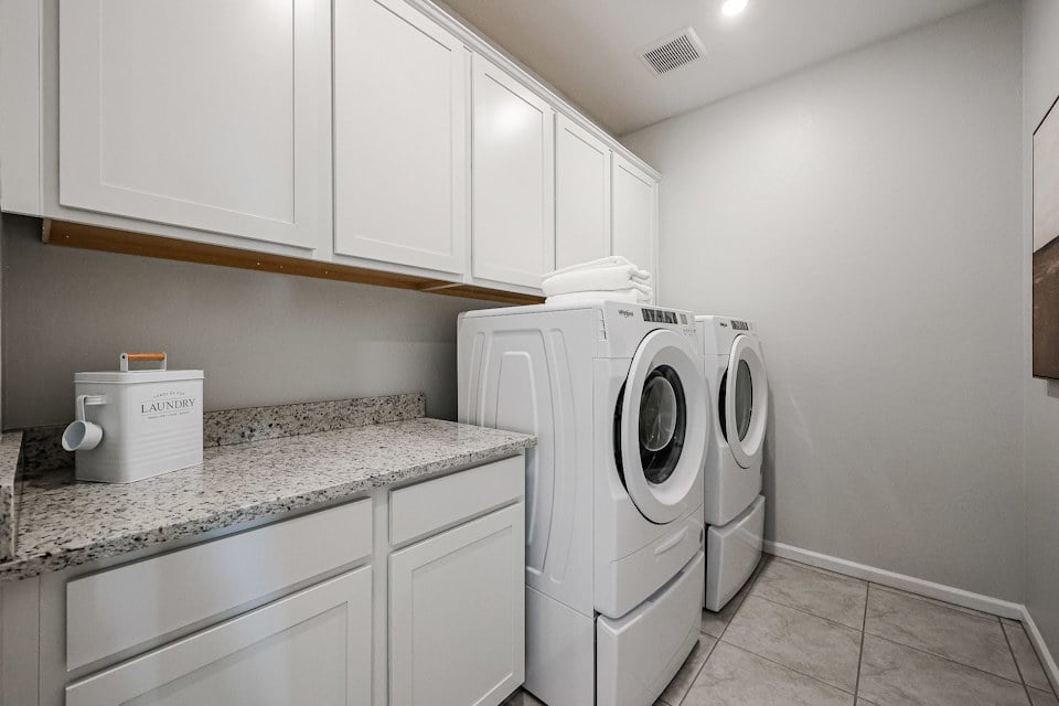A washing machine in a kitchen.