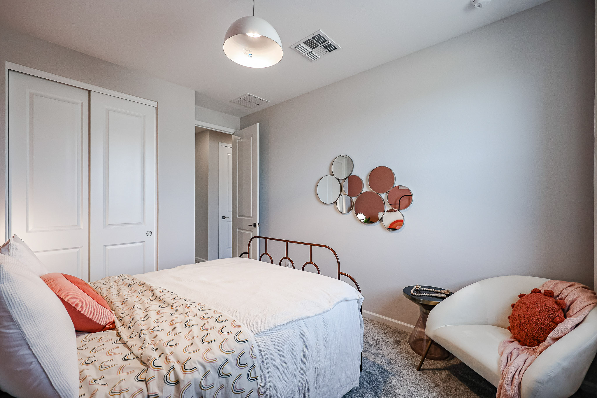 A bedroom with a bed and a couch.