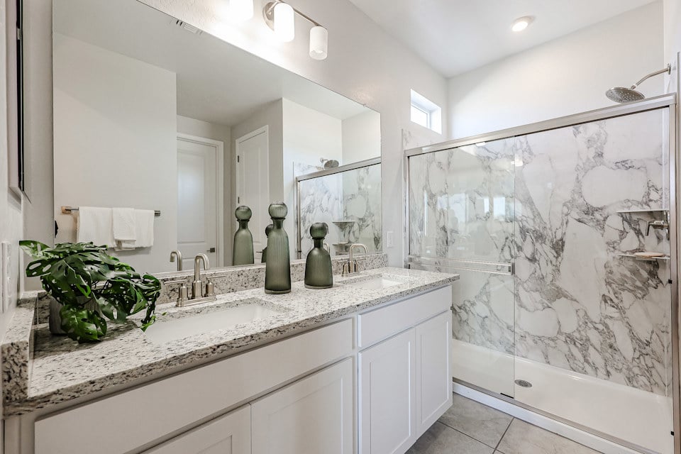 A bathroom with a marble countertop.
