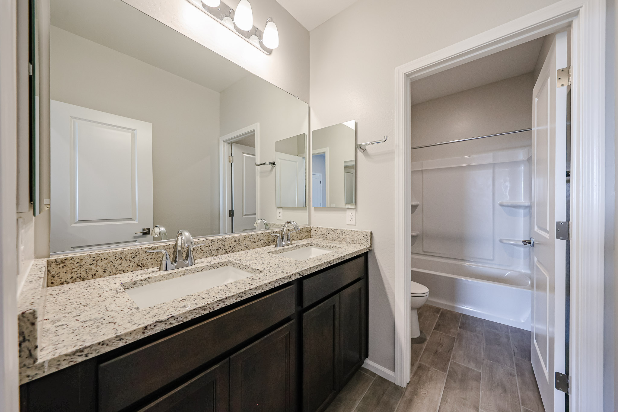 A bathroom with a marble countertop.