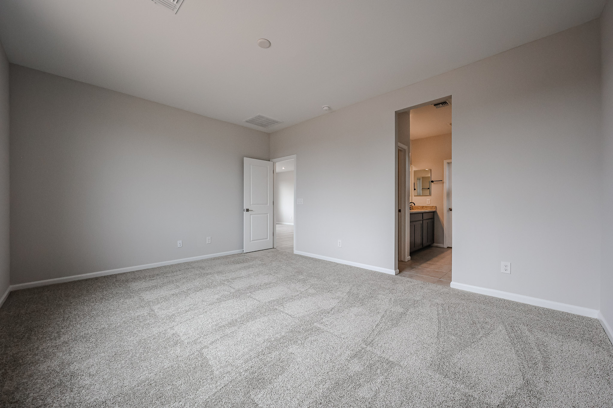 A hallway with white walls.