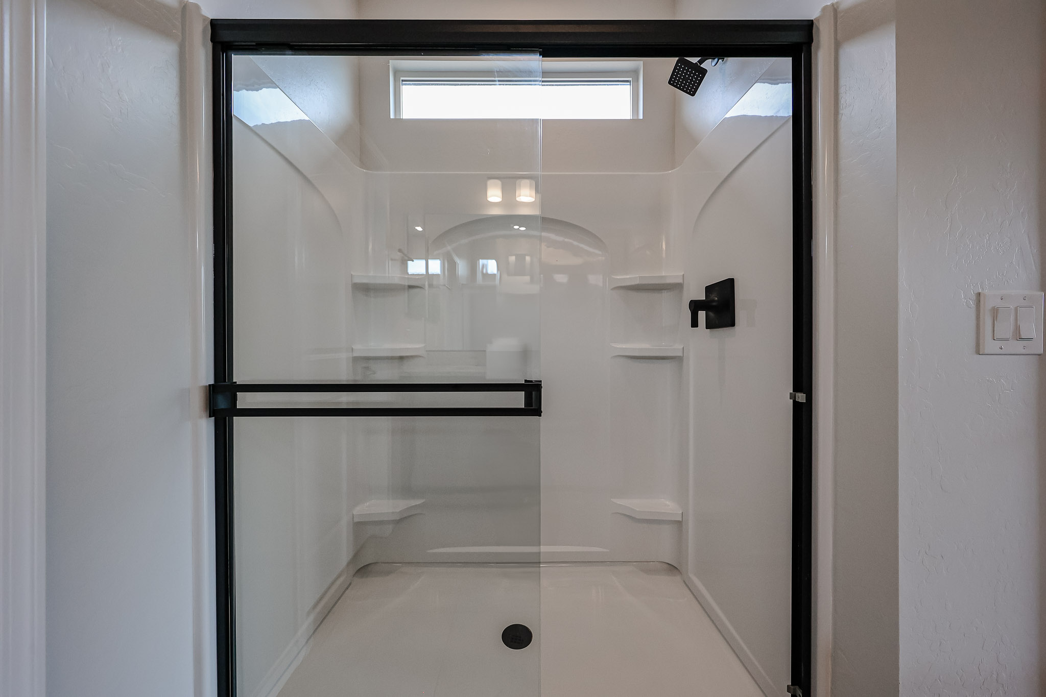A bathroom with a glass shower.