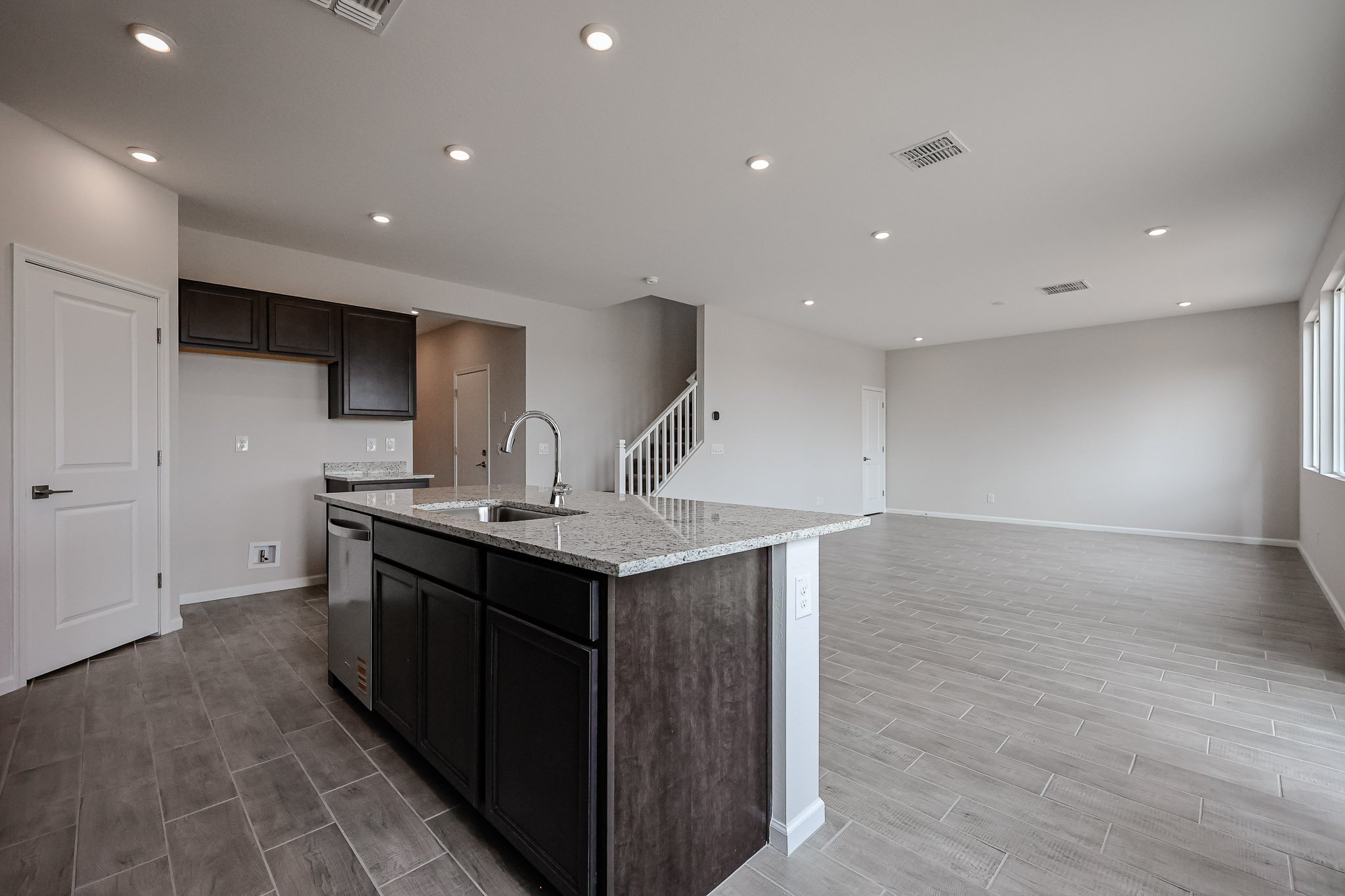 A kitchen with a marble countertop.