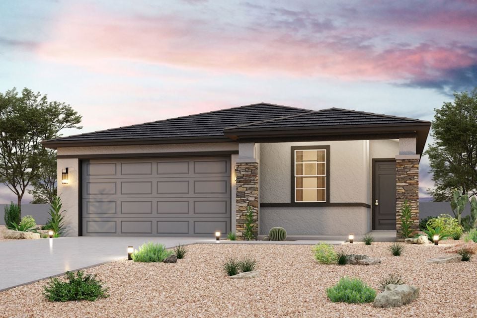 A house with a gravel driveway.