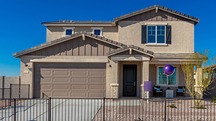 A house with a fence around it.